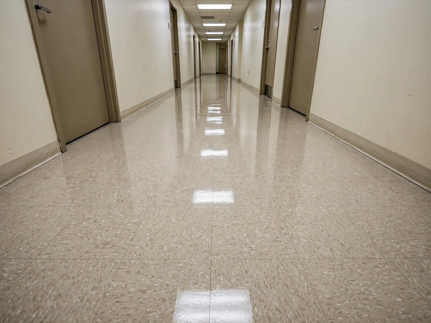 Glossy commercial corridor floor after a strip and seal